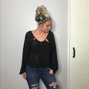 Cute sheer black top !